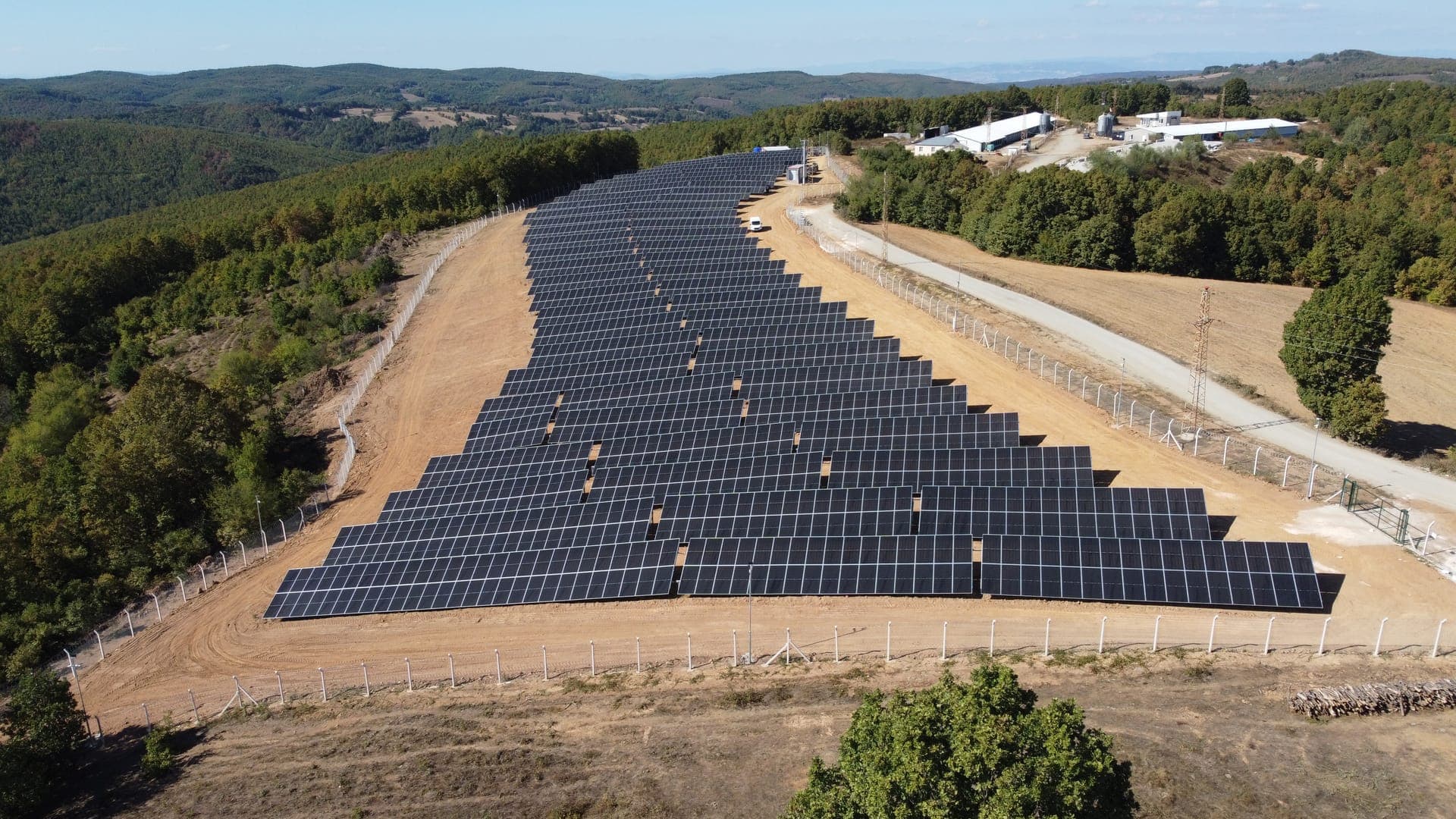 Robotic panel cleaning for ground-mounted solar power plants